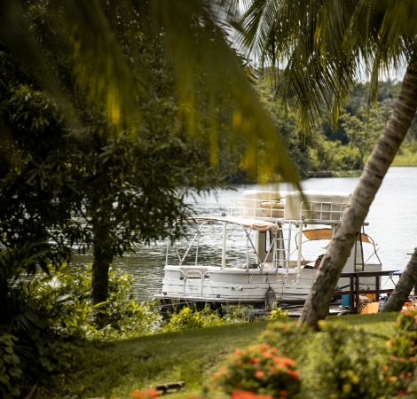 An image of one of the luxury 10-seater boats that are part of the resort’s private fleet that can be booked for an hour long cruise on the Volta River and views of Adomi Bridge and are offered as additional activity at The Royal Senchi Hotel & Resort in Ghana
