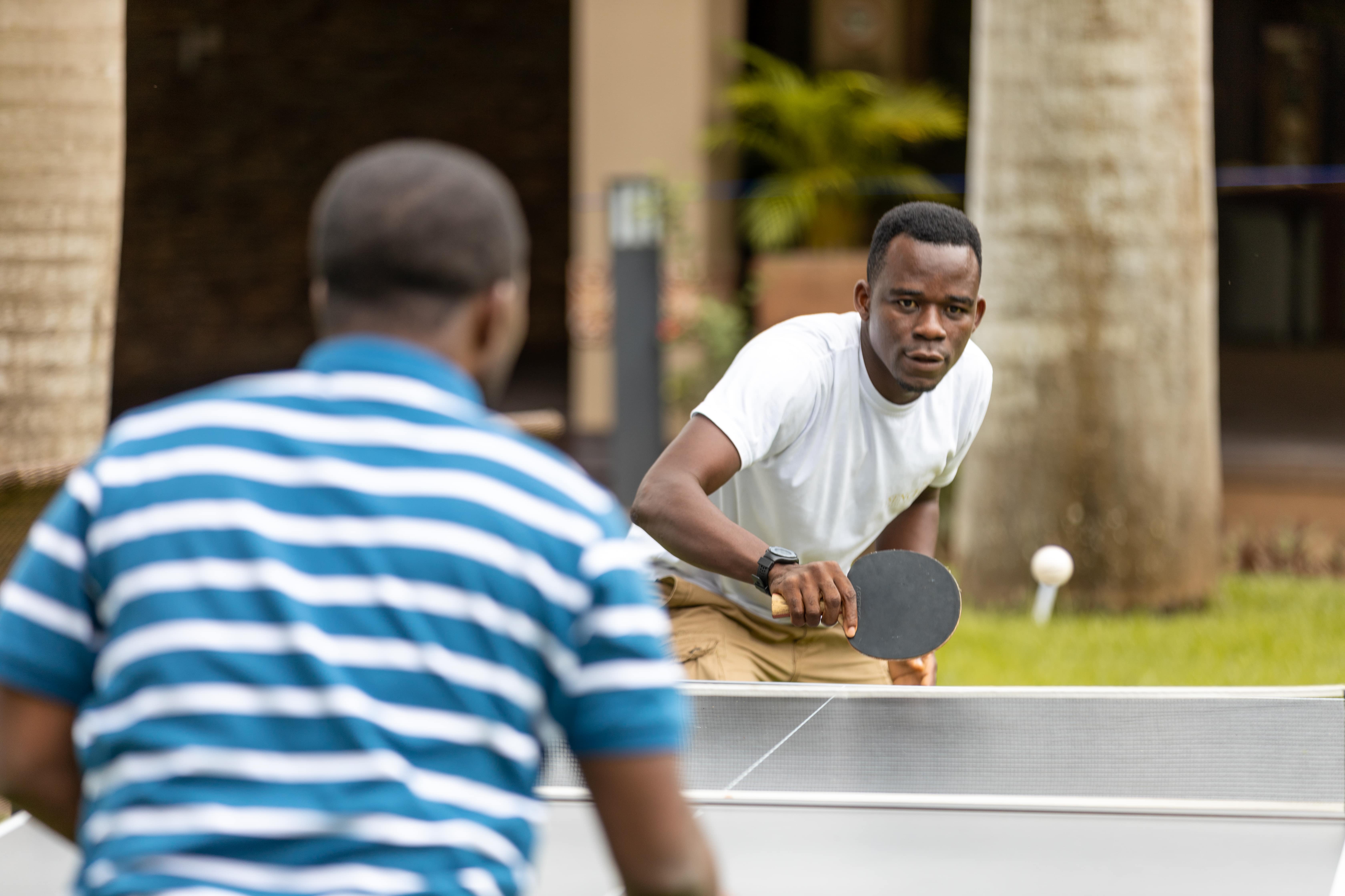 An image of guests playing table tennis, one of the activities offered at The Royal Senchi Hotel & Resort in Ghana
