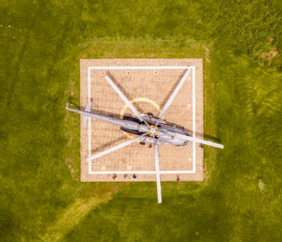 An aerial photo of a helicopter parked at the helipad at The Royal Senchi Hotel & Resort in Ghana