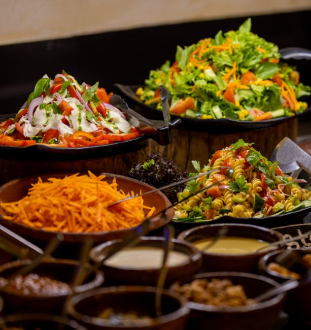An image of the variety of fresh garden and pasta salads being served at the buffet at The Senchi Restaurant in The Royal Senchi Hotel & Resort in Ghana