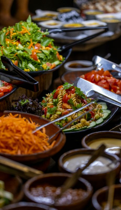 An image of the variety of fresh garden and pasta salads being served at the buffet at The Senchi Restaurant in The Royal Senchi Hotel & Resort in Ghana