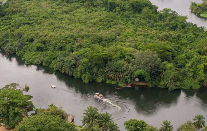 An image of one of the luxury 10-seater boats that are part of the resort’s private fleet that can be booked for an hour long cruise on the Volta River and views of Adomi Bridge and are offered as additional activity at The Royal Senchi Hotel & Resort in Ghana
