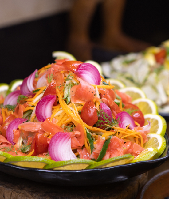 A close up image of fresh salad being served at The Senchi Restaurant at The Royal Senchi Hotel & Resort in Ghana