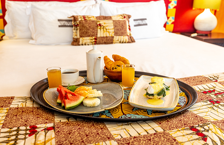 A close up of fresh breakfast being served in bed in The River View Room at The Royal Senchi Hotel & Resort, Ghana