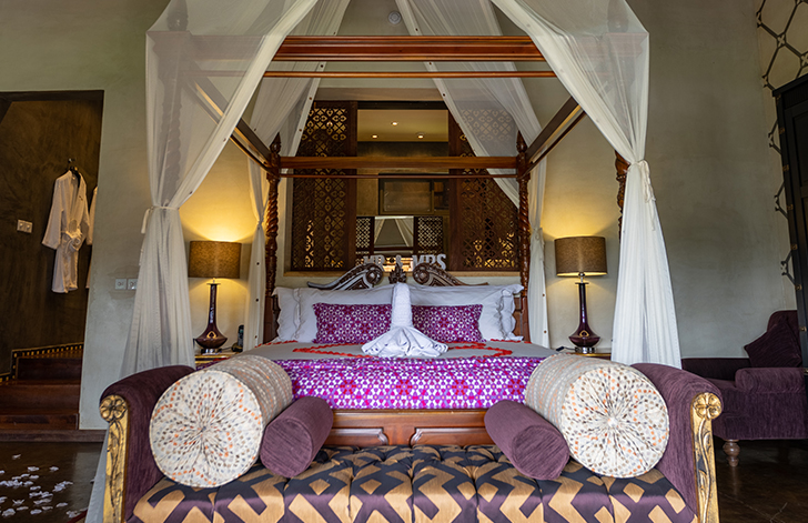 View of the four poster bed in The Picathartes Presidential Suite at The Royal Senchi Hotel & Resort, Ghana