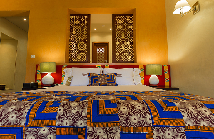 A close-up view of the bed in The River View Room at The Royal Senchi Hotel & Resort, Ghana