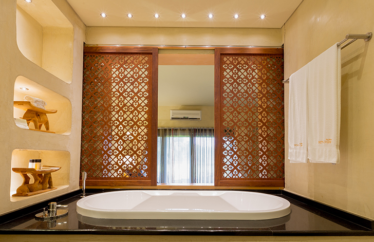 View of the bathroom from The River View Room at The Royal Senchi Hotel & Resort, Ghana